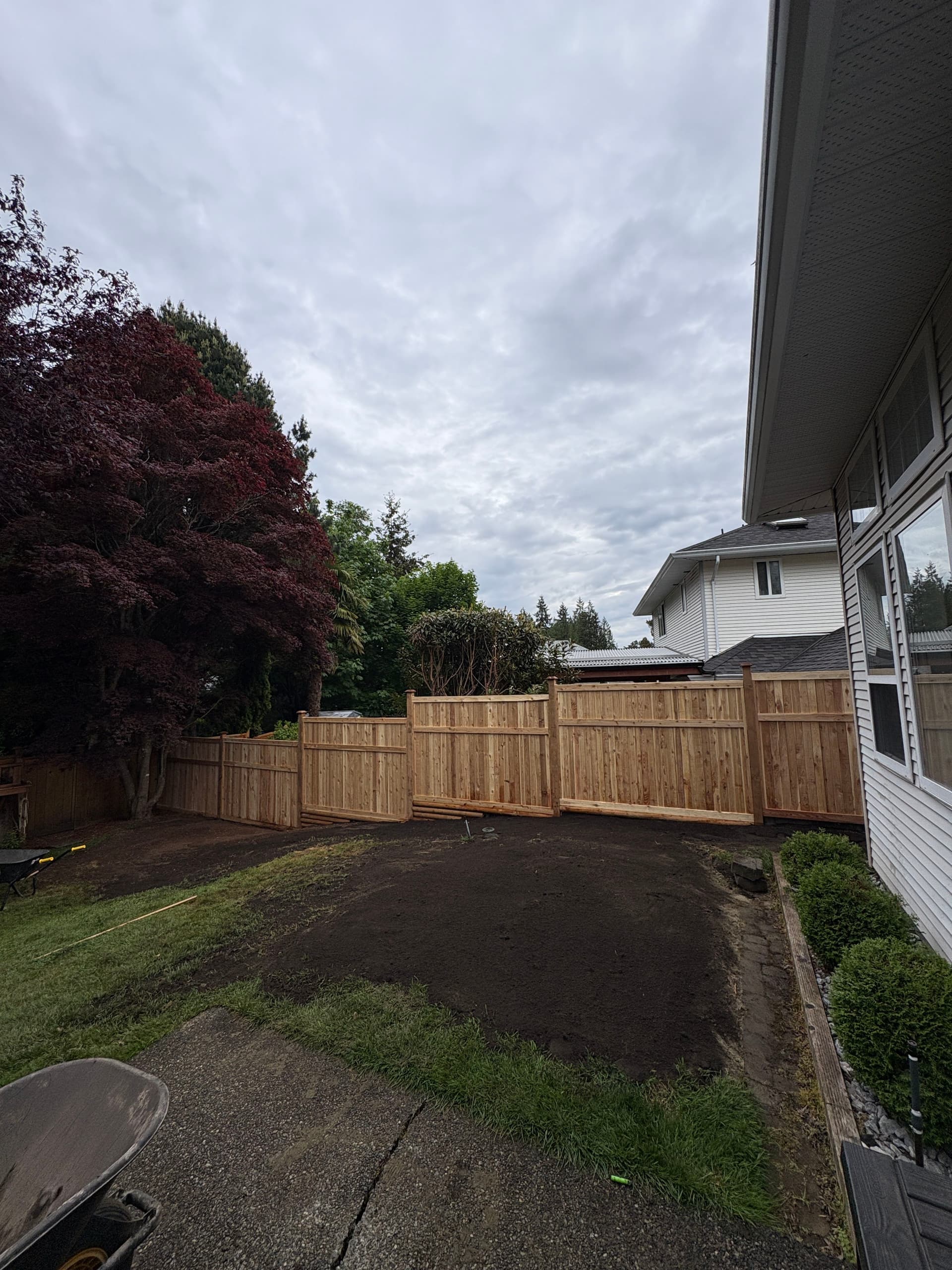 Gallery photos for Cedar Fence and Retaining Wall Give This Yard Real Structure: Image #2