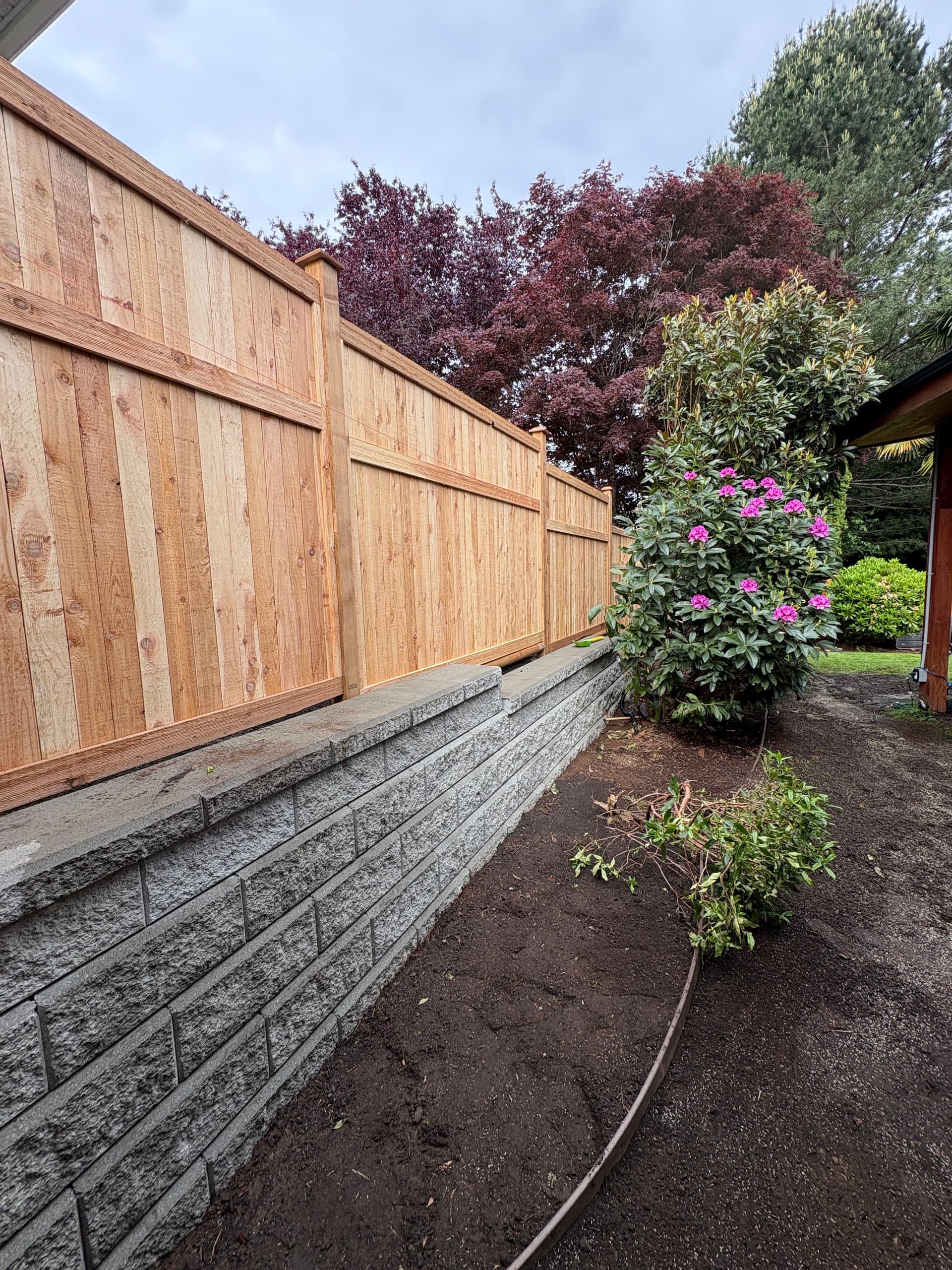 Gallery photos for Cedar Fence and Retaining Wall Give This Yard Real Structure: Image #1